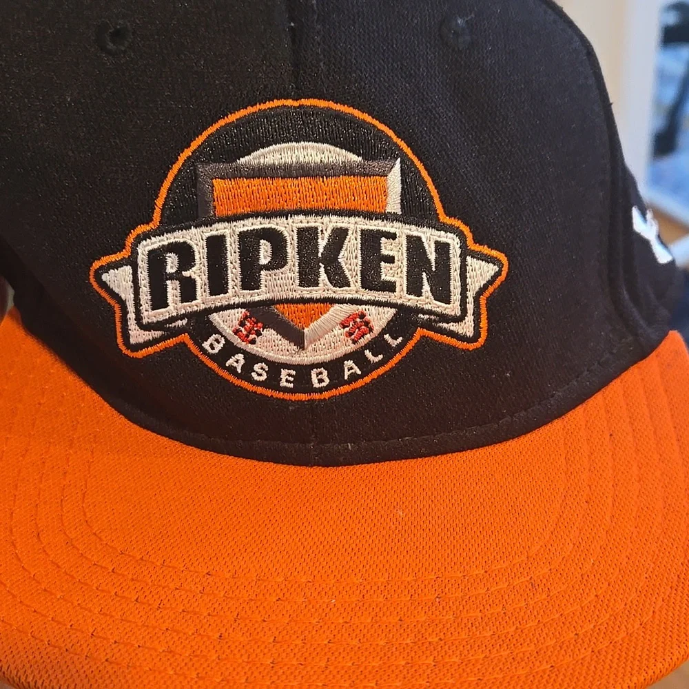 Under Armour Ripken Baseball Cap in Black and Orange Youth